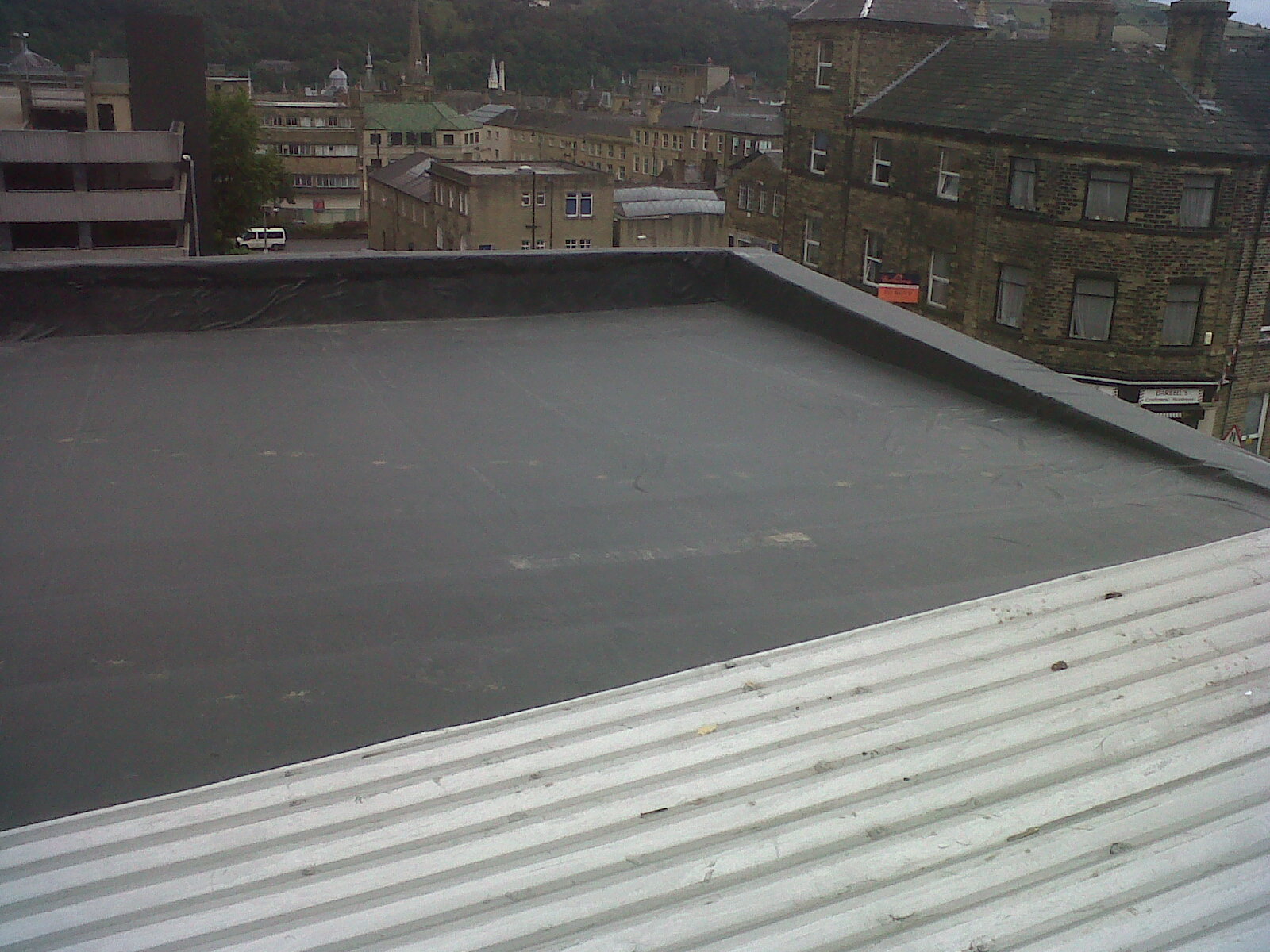 Black EPDM roof on a city building